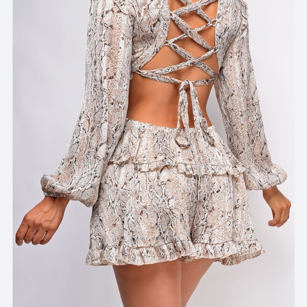 Snake Print Cut Out Romper.  Open back tie. Worn once.  Very pretty!!